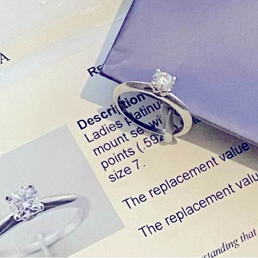 Certified hearts on fire diamond engagement ring.
